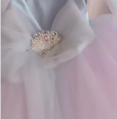 Close-up of a decorative brooch on a light fabric background