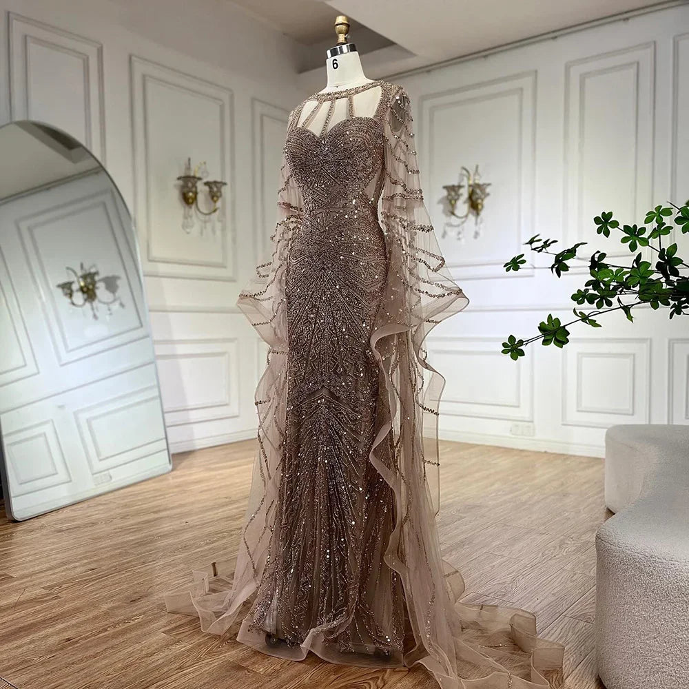 Golden hour mermaid gown with cape sleeves