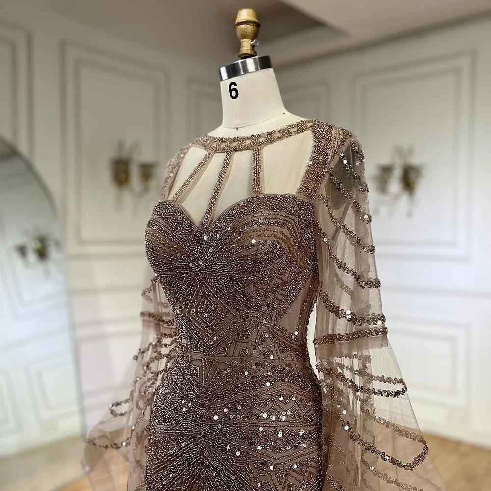 Golden hour mermaid gown with cape sleeves