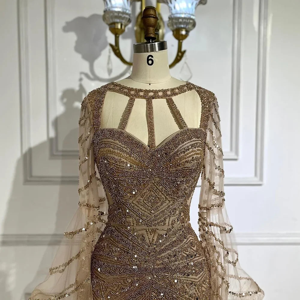 Golden hour mermaid gown with cape sleeves