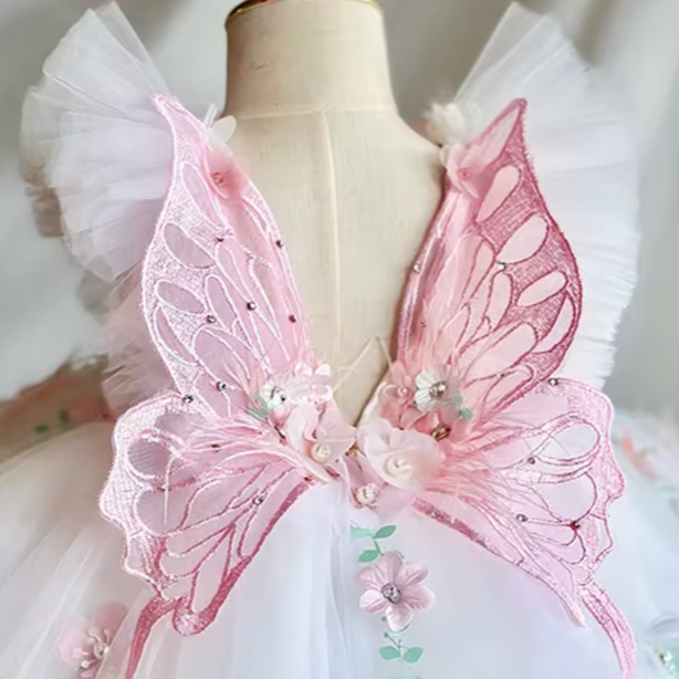 Pink fairy wings on a mannequin with a white background